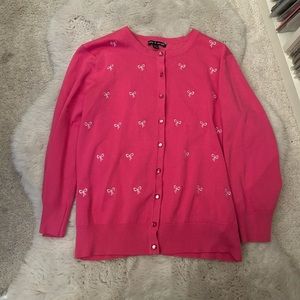 Bright pink cardigan with cute little bows